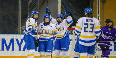 The TMU Bold women's hockey team celebrating the fourth goal of the afternoon