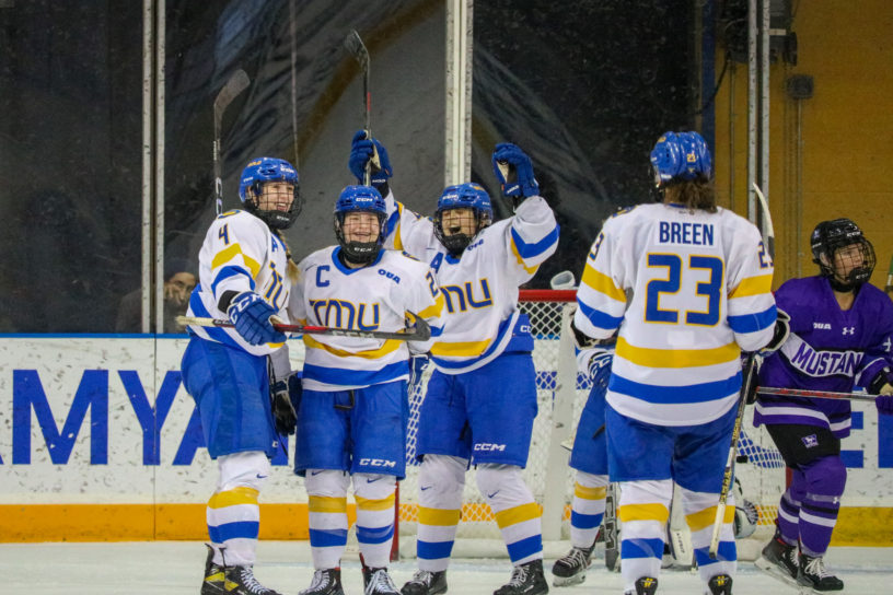 The TMU Bold women's hockey team celebrating the fourth goal of the afternoon