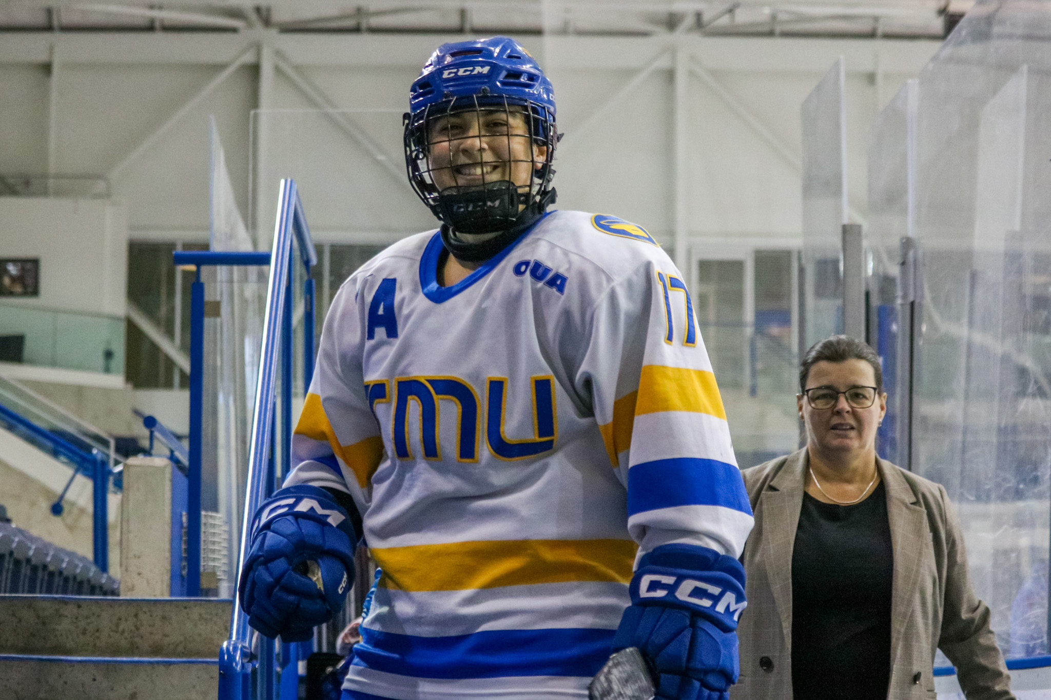 Caley Davis walking of the rink with a smile on her face