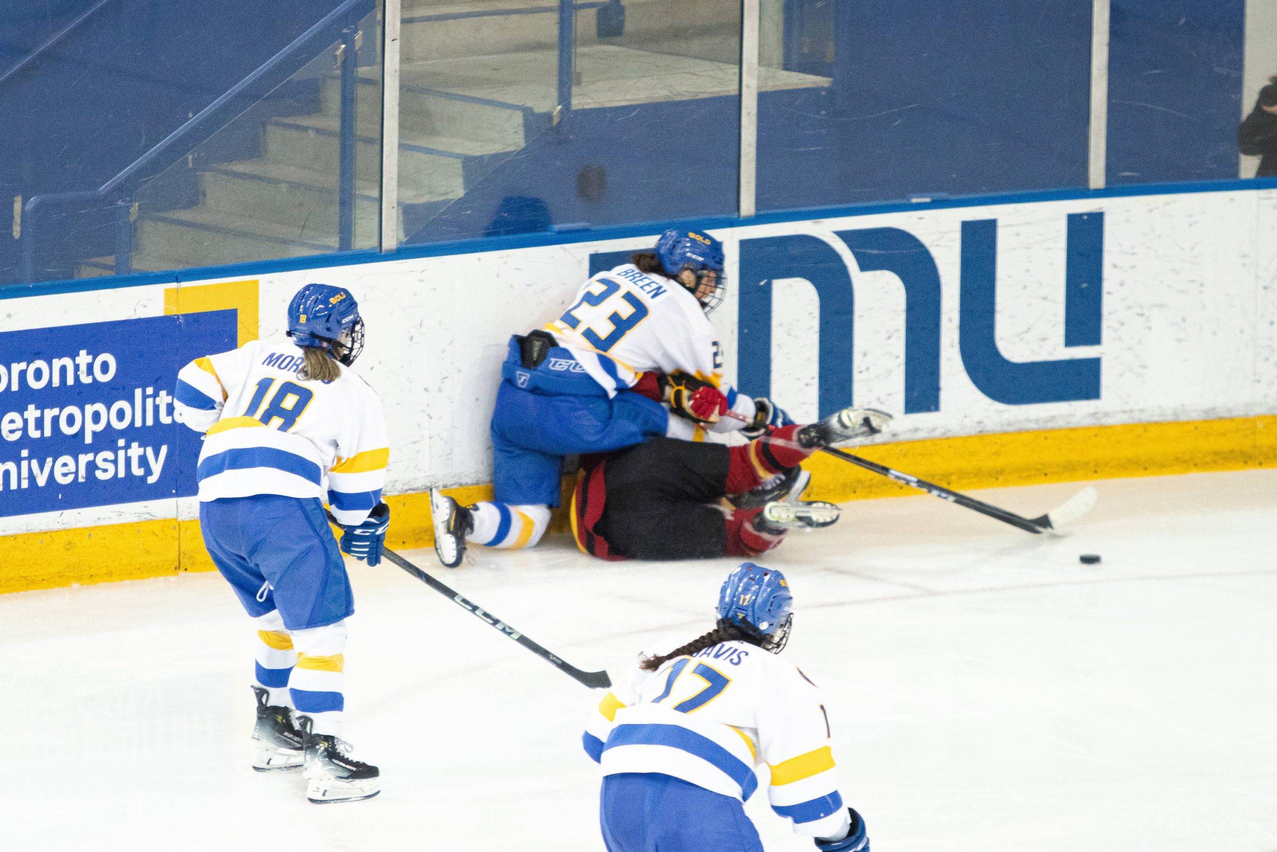 Megan Breen putting a Guelph player to the ground