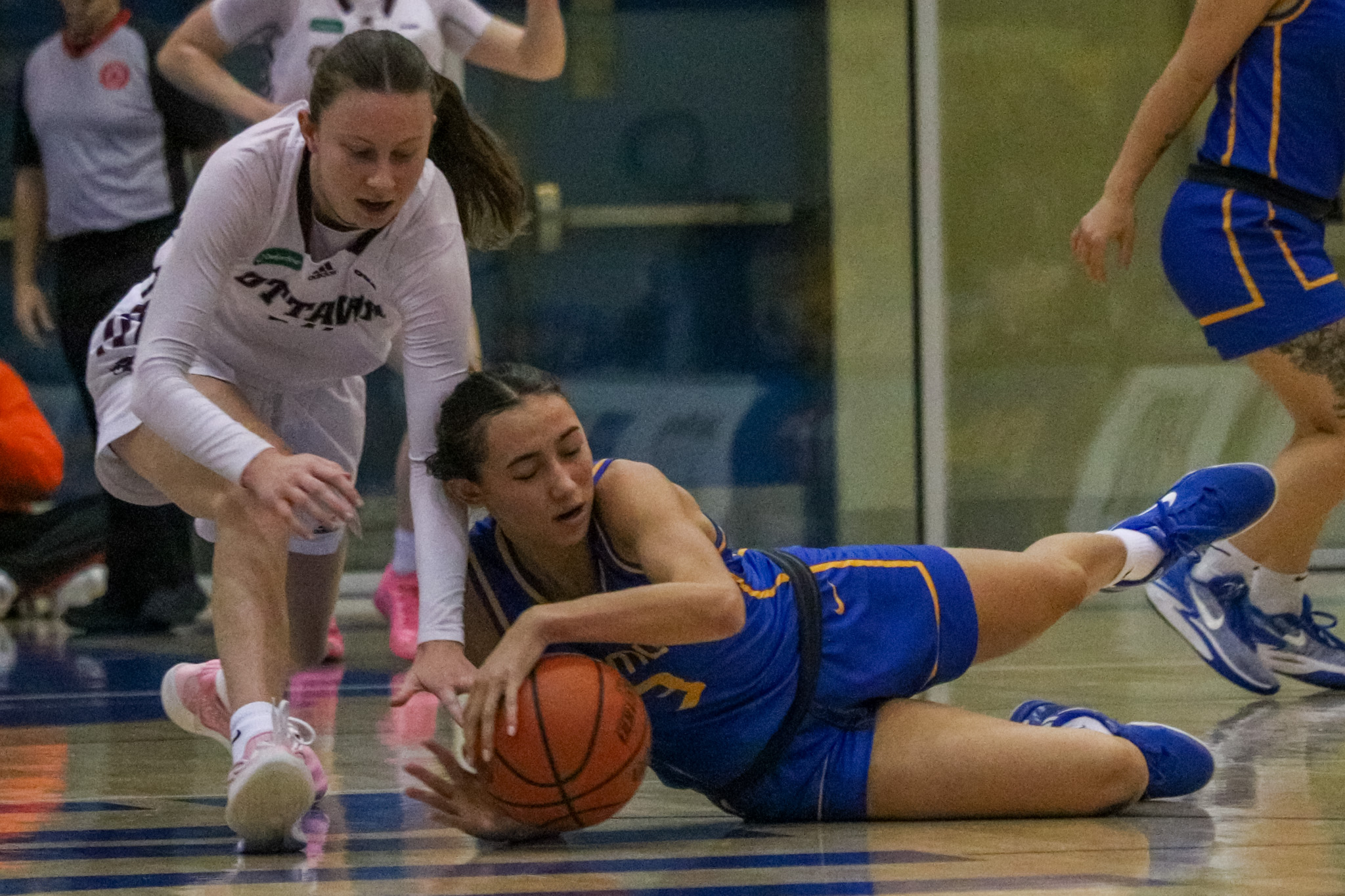 Hailey Franco-DeRyck battling for the ball in the ground