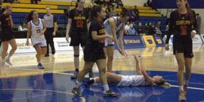 Kallie Hall being lift up from the ground after losing the game