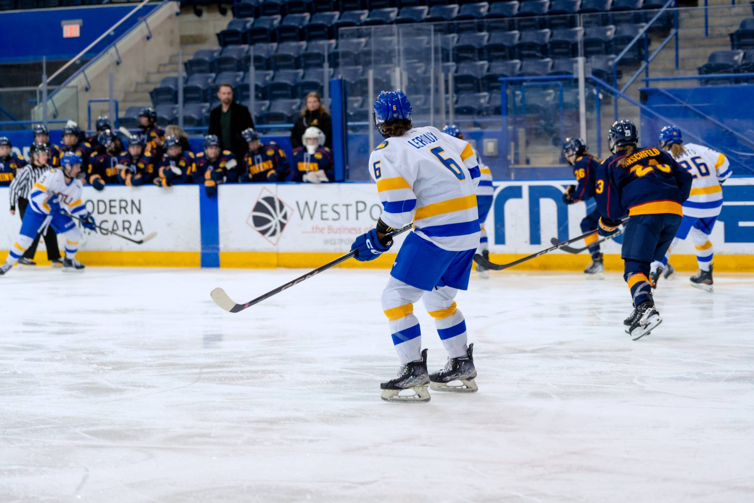 A TMU Bold player looking at the puck