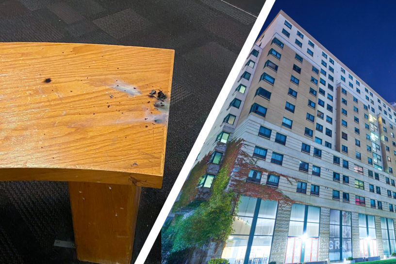 composition of burned wooden bench and pitman hall to the right