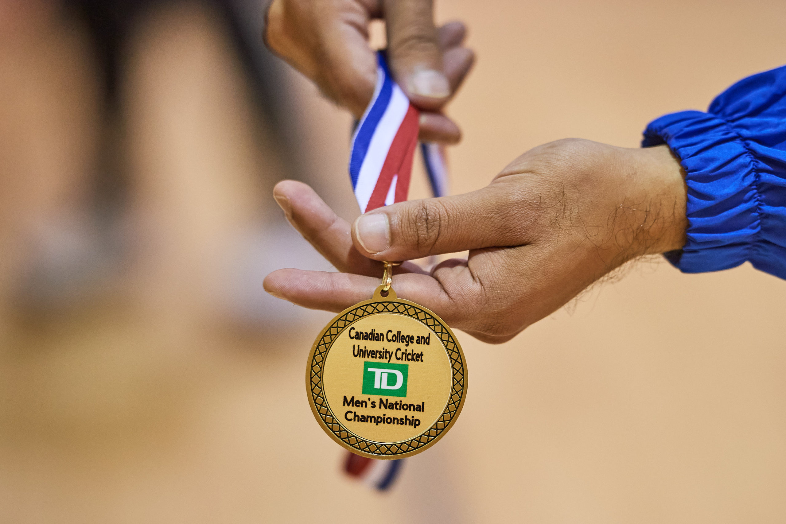 the medal of the national champions, TMU cricket team