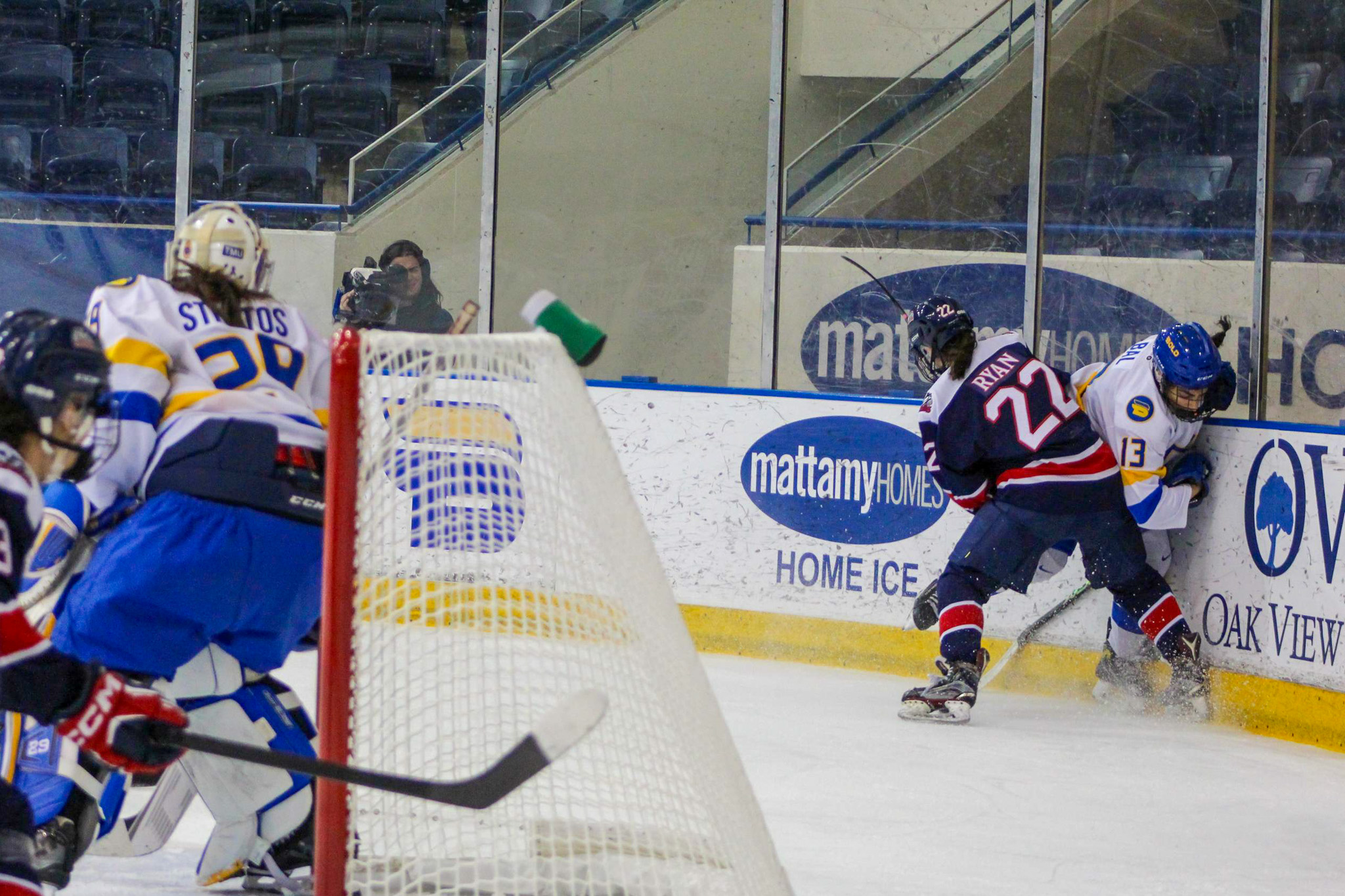 Two players disputing the puck