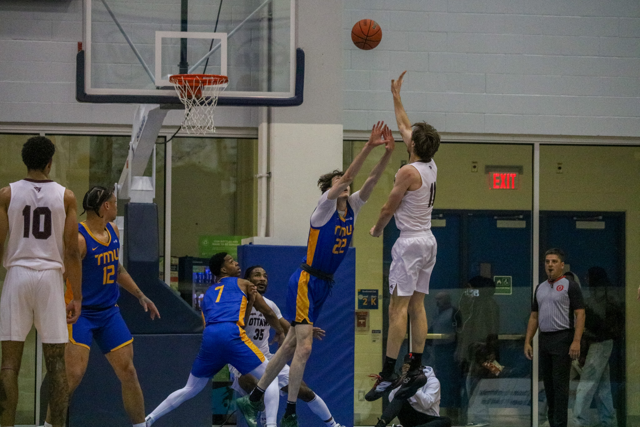 Aiden Wilson aiming to block a shot from a Ottawa player