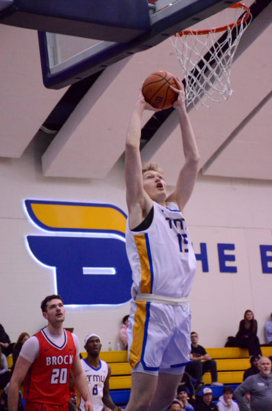 Andrejs Silkonocs does a slam dunk with the Bold B logo in the background