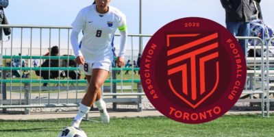 Ivymae Perez about to kick a corner with a logo of AFC Toronto to her side announcing her signing with the team