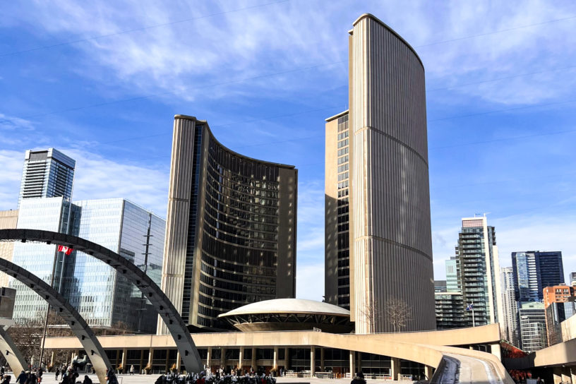 A photograph image of City Hall with a view of the skating rink