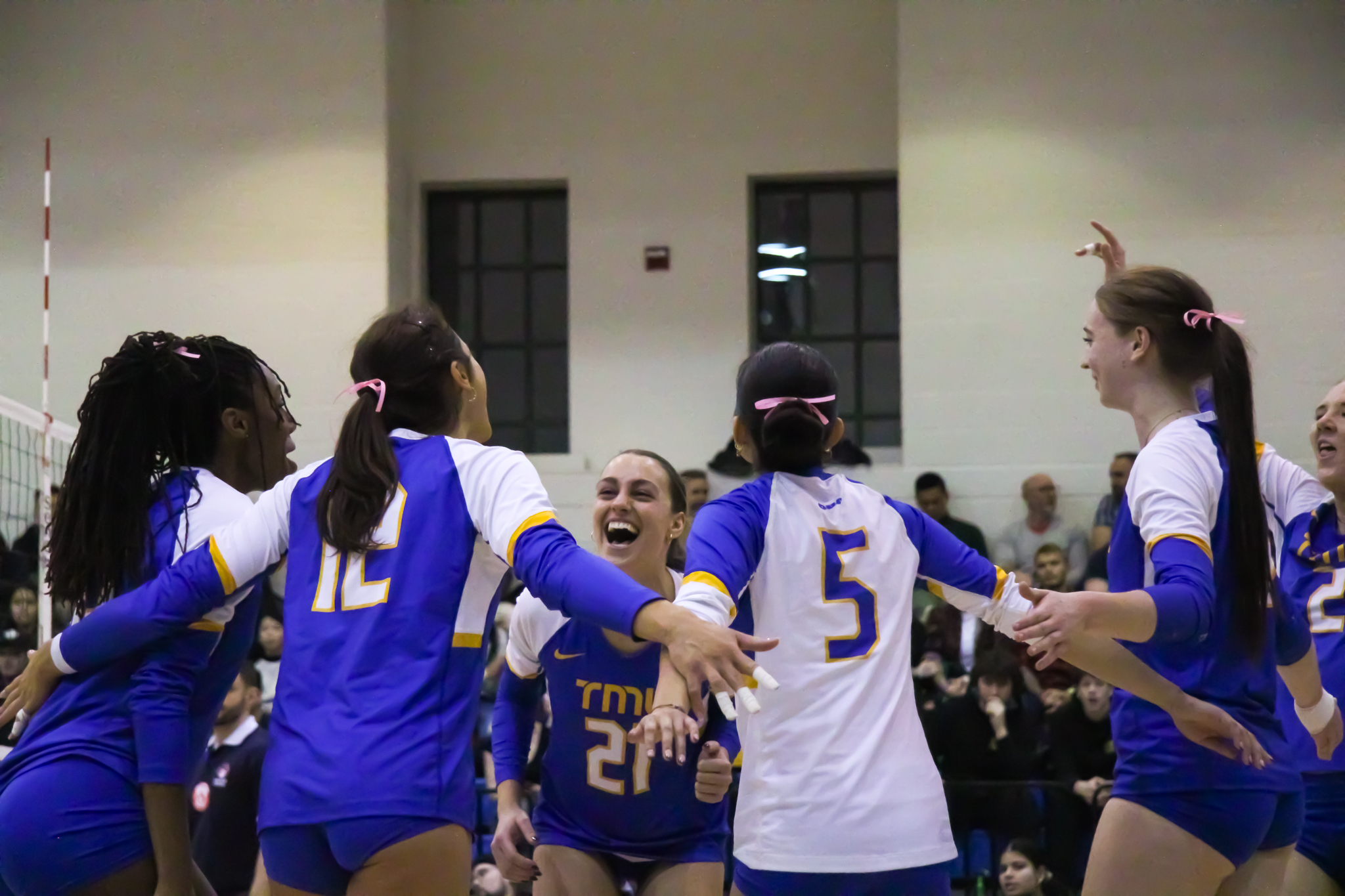 The Bold volleyball women's team celebrating a point