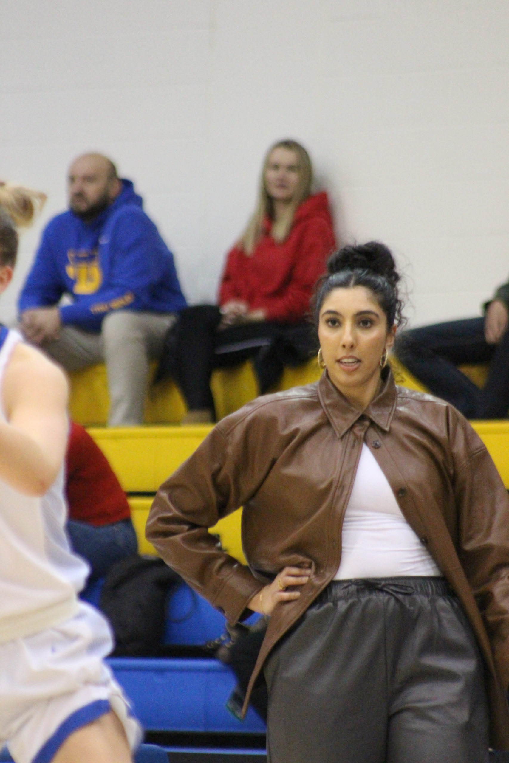 Shae Dheensaw stands at the Brock Badgers bench at the MAC