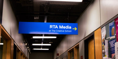 A board sign inside of the Rogers Communication Centre of the RTA media department.