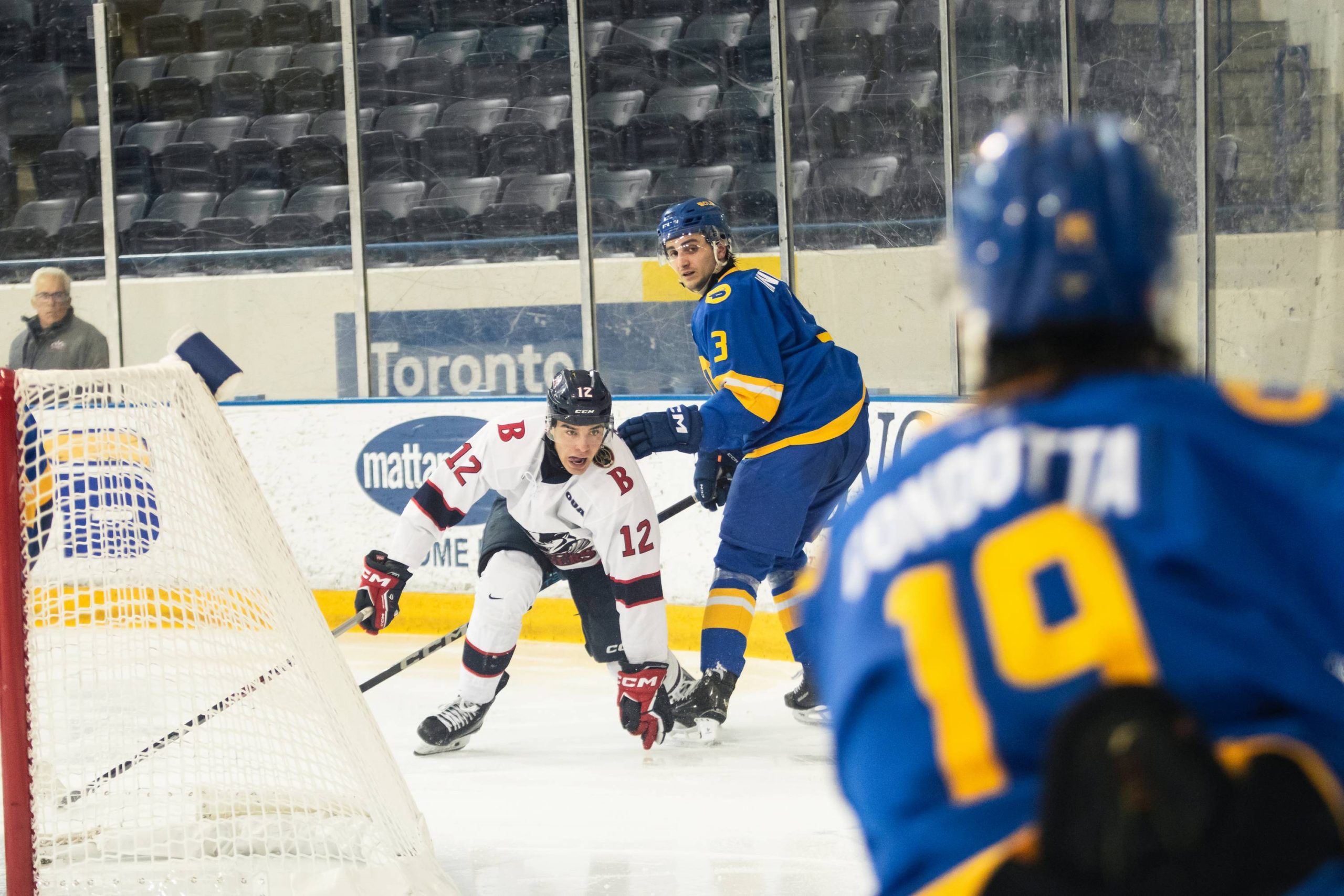 Joe Ianniello looks across the ice at Jaden Condotta behind the Bold net