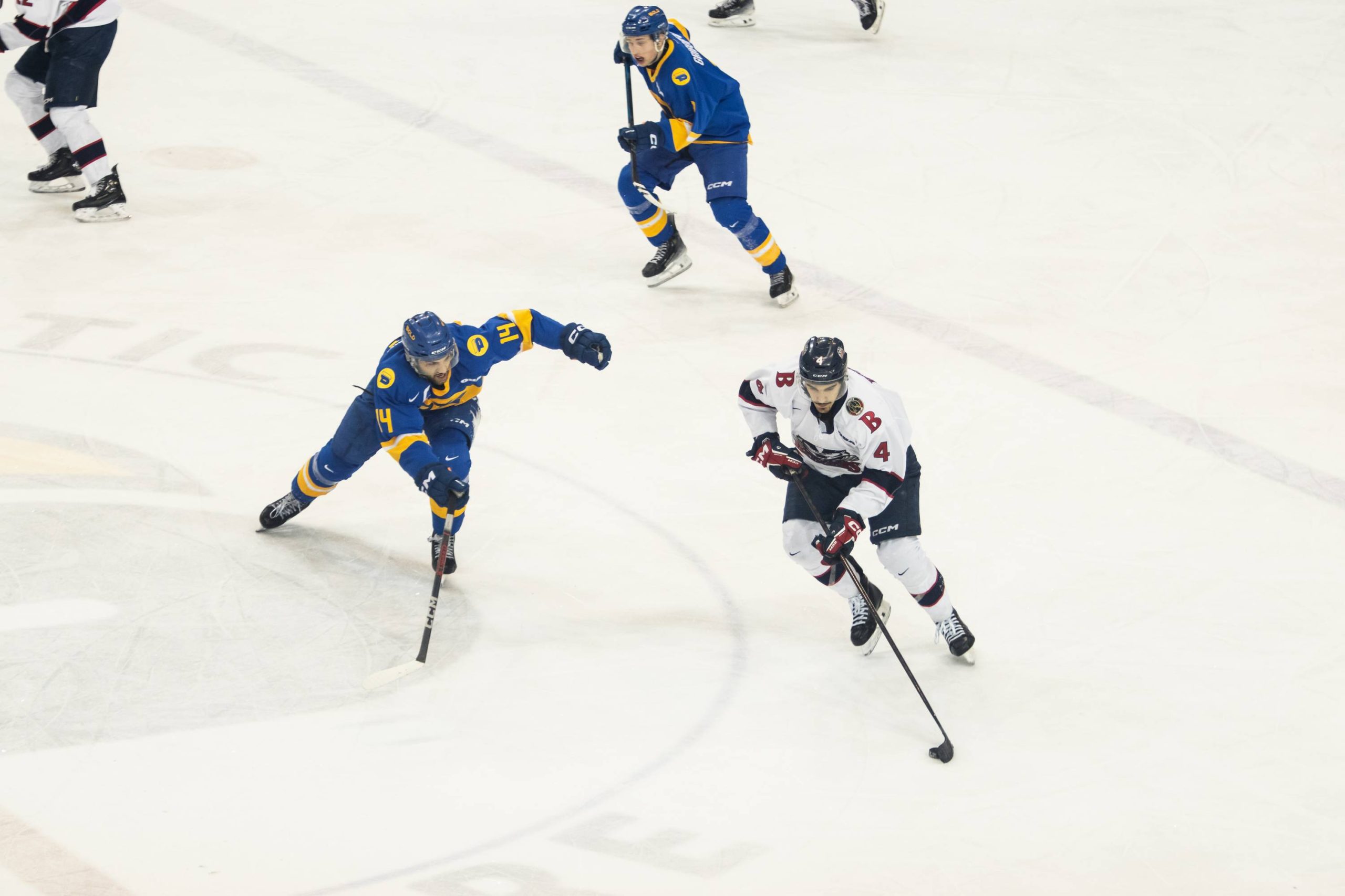 Chris Playfair reaches his stick out as he tracks down a Brock Badgers player