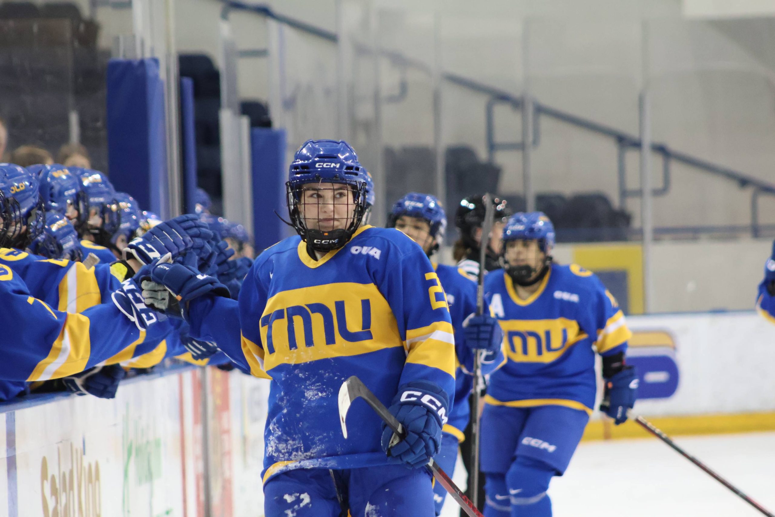 A Bold player celebrating her goal with the bench