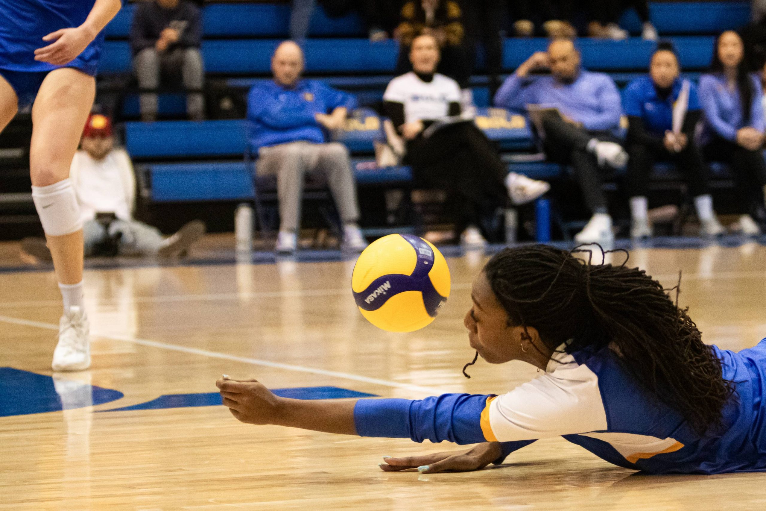 Rayanna Amos-Ross Fisher attempting to dig the ball