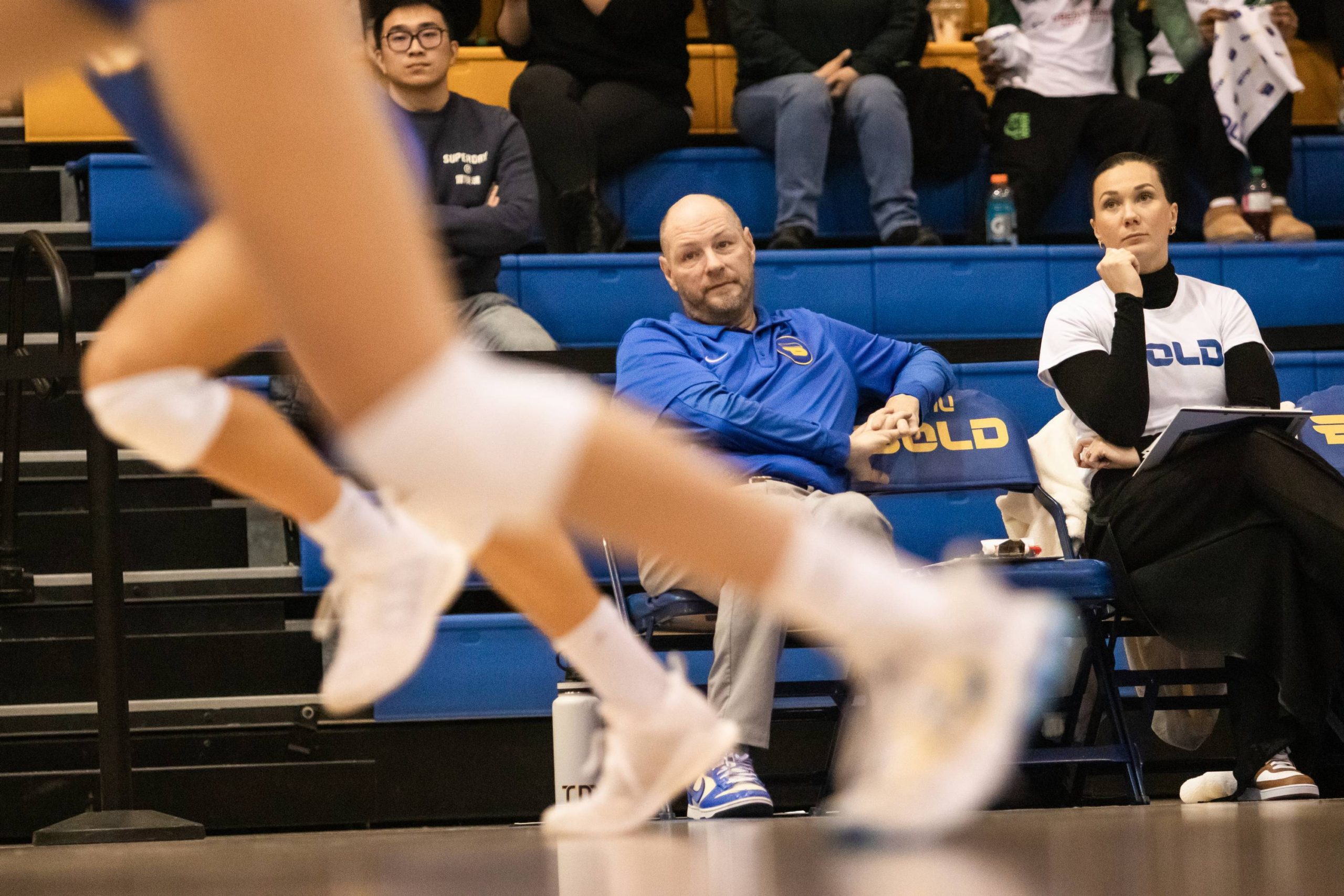 Head coach Dustin Reid looking at the court