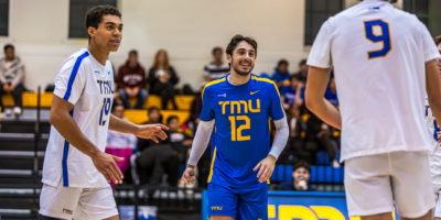 Three TMU Bold players celebrating a point