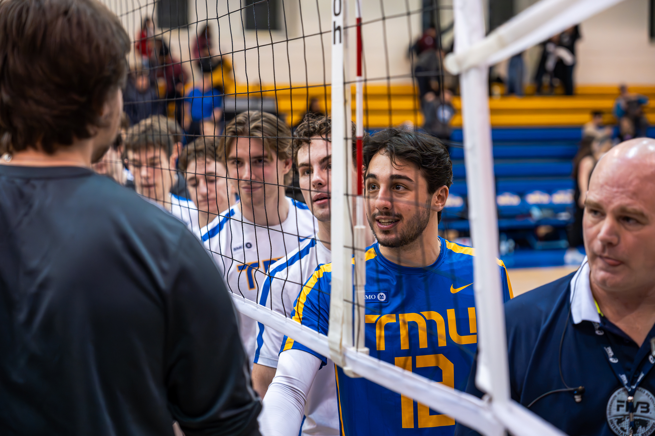 The TMU Bold players shaking hands with the other team at the end of the game