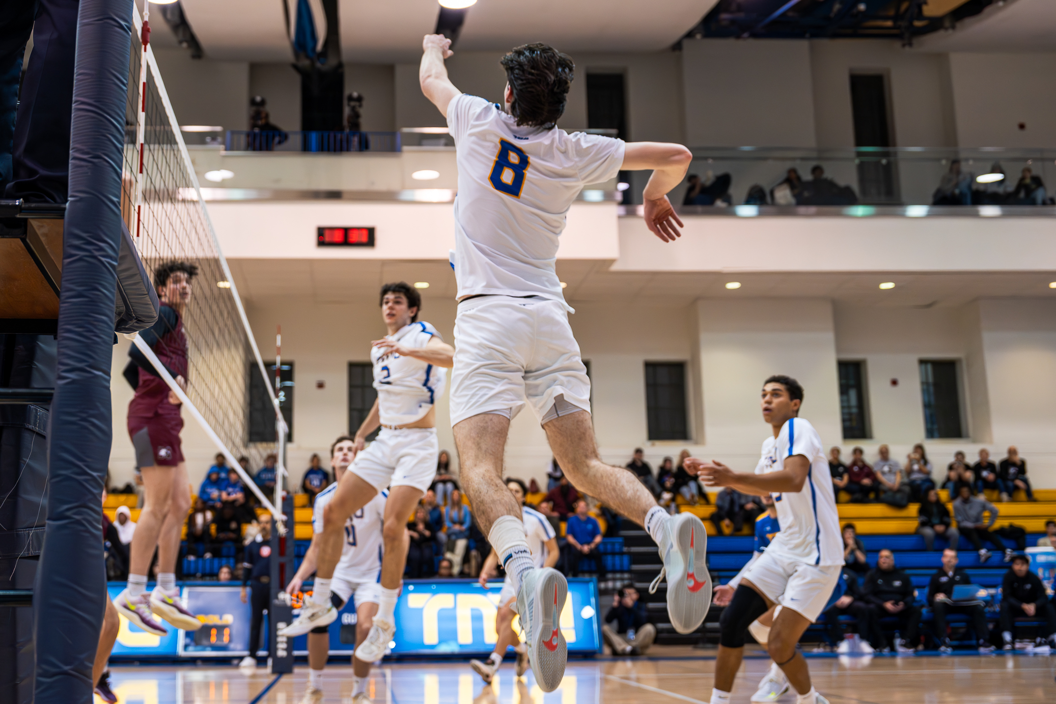 Riley Donovan jumping to spike the ball