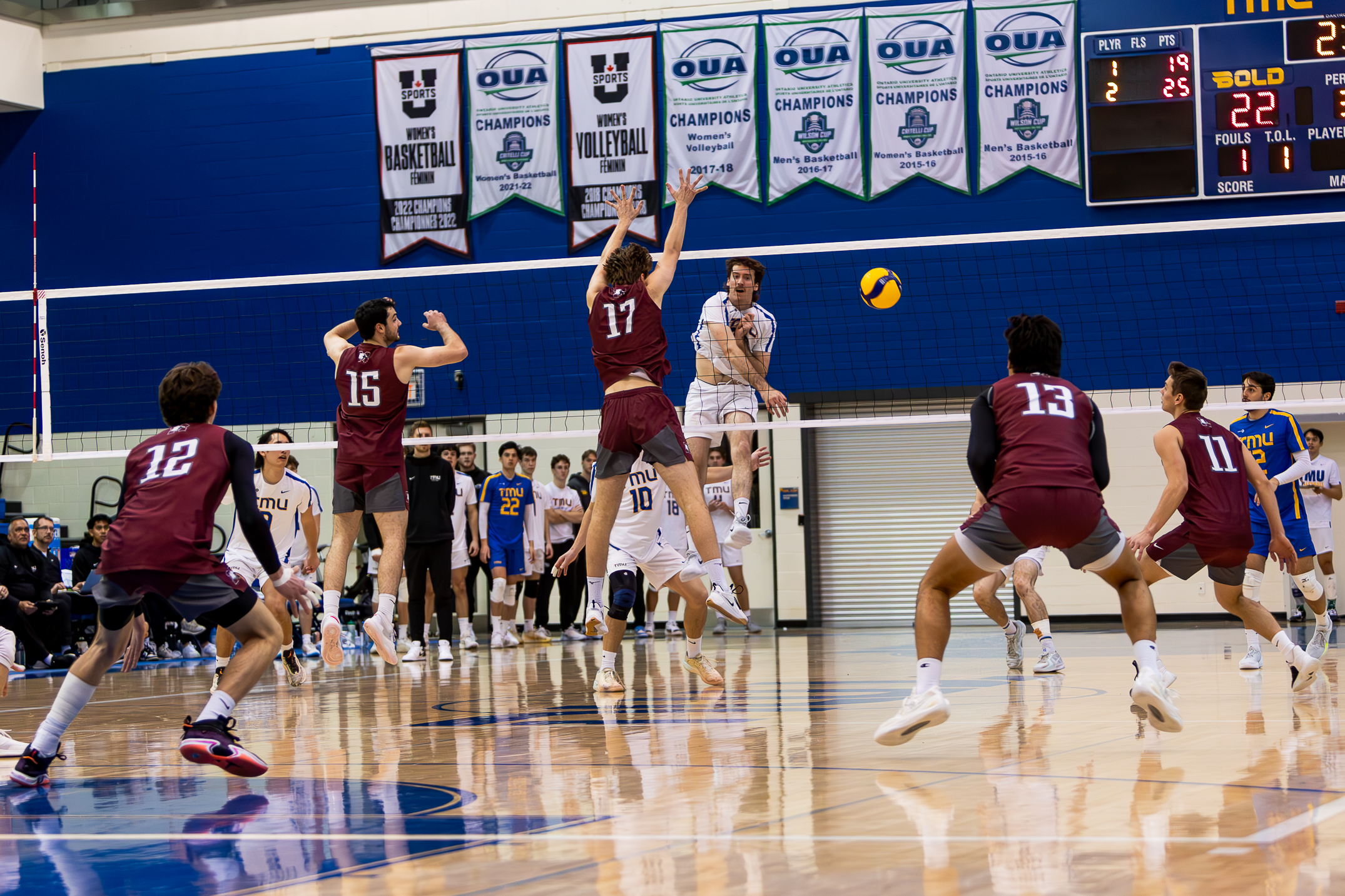 Alex King hitting the ball at the McMaster's defence wall