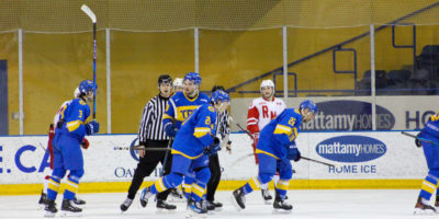 TMU Bold skate past the RMC net after a goal