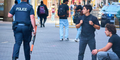 police walking past students