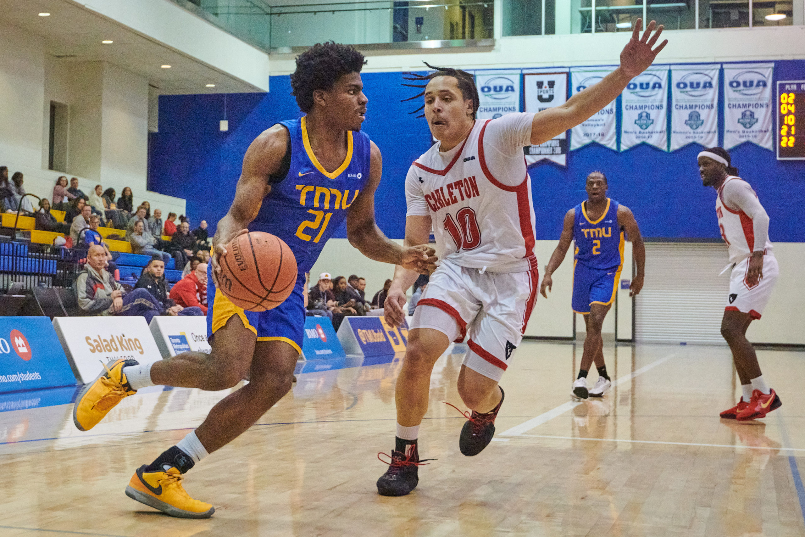 Gabriel Gutsmore dribbles a ball under the basket 