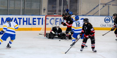 Taliya Hildebrandt hitting the puck