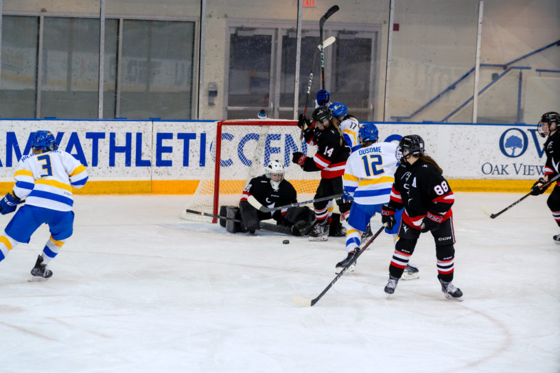 Taliya Hildebrandt hitting the puck