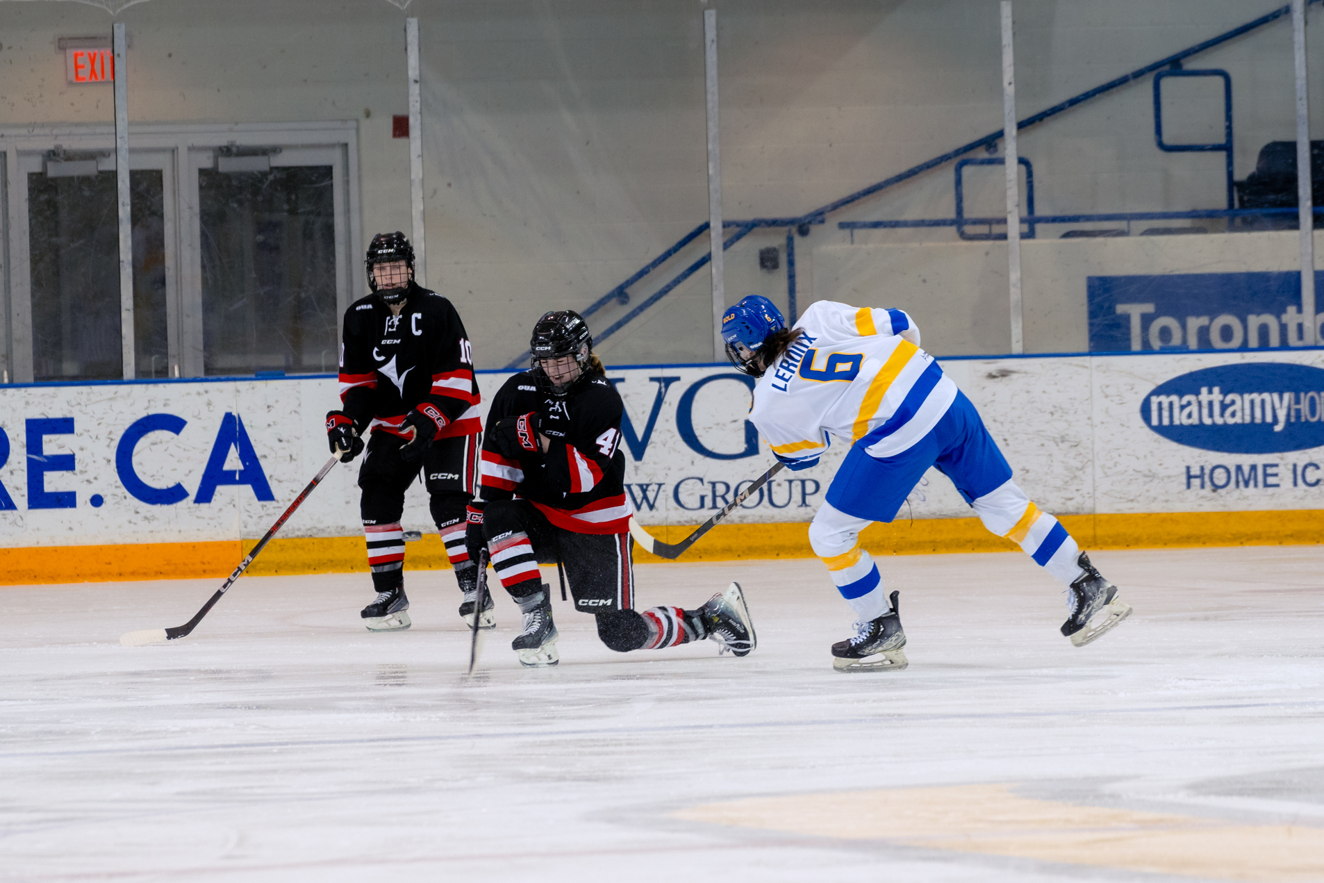 Katie Leroux hitting the puck