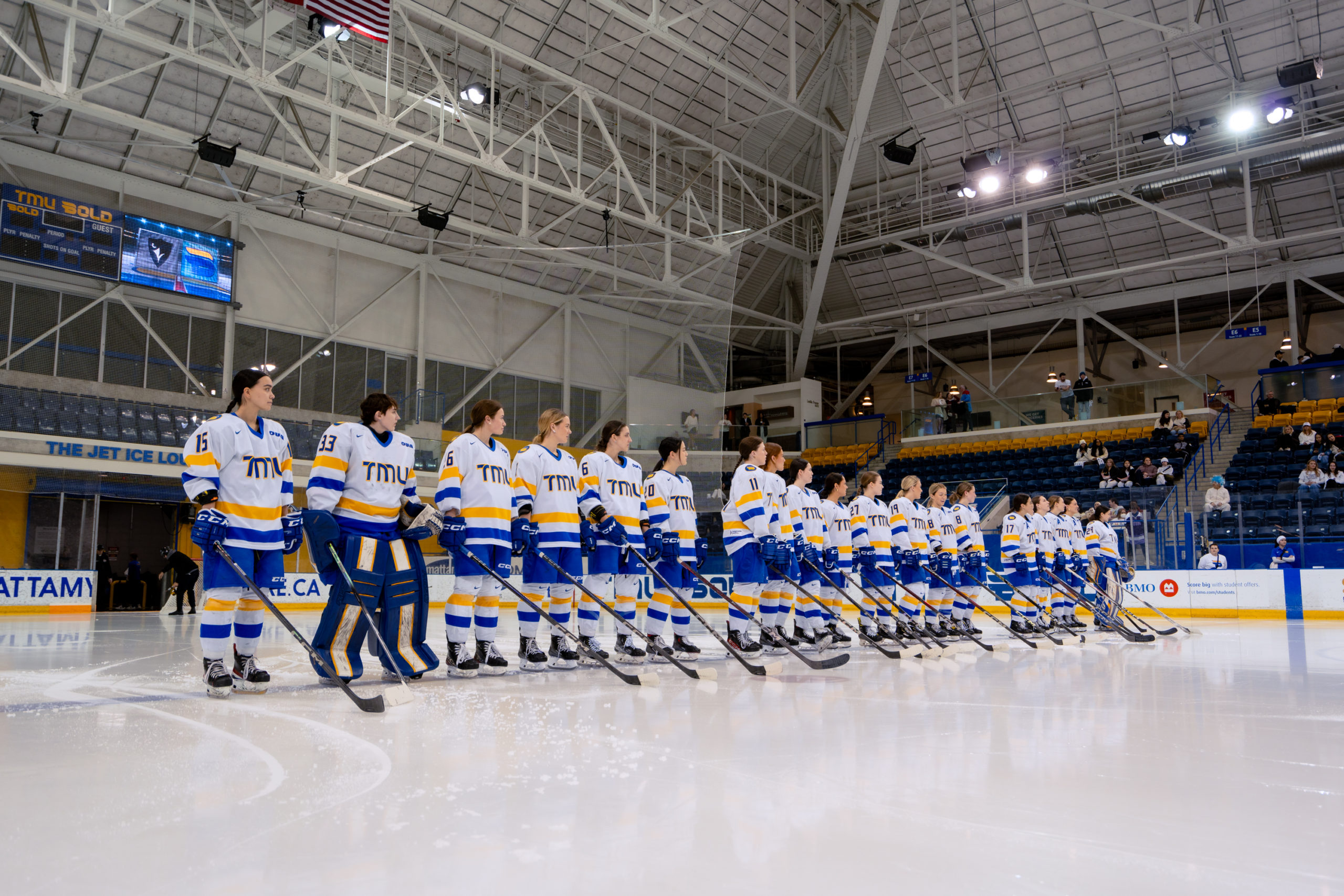 The TMU Bold women's team standing with the anthem playing