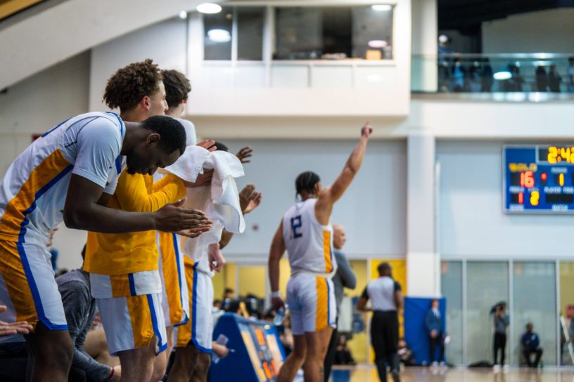 The TMU Bold bench celebrating a point