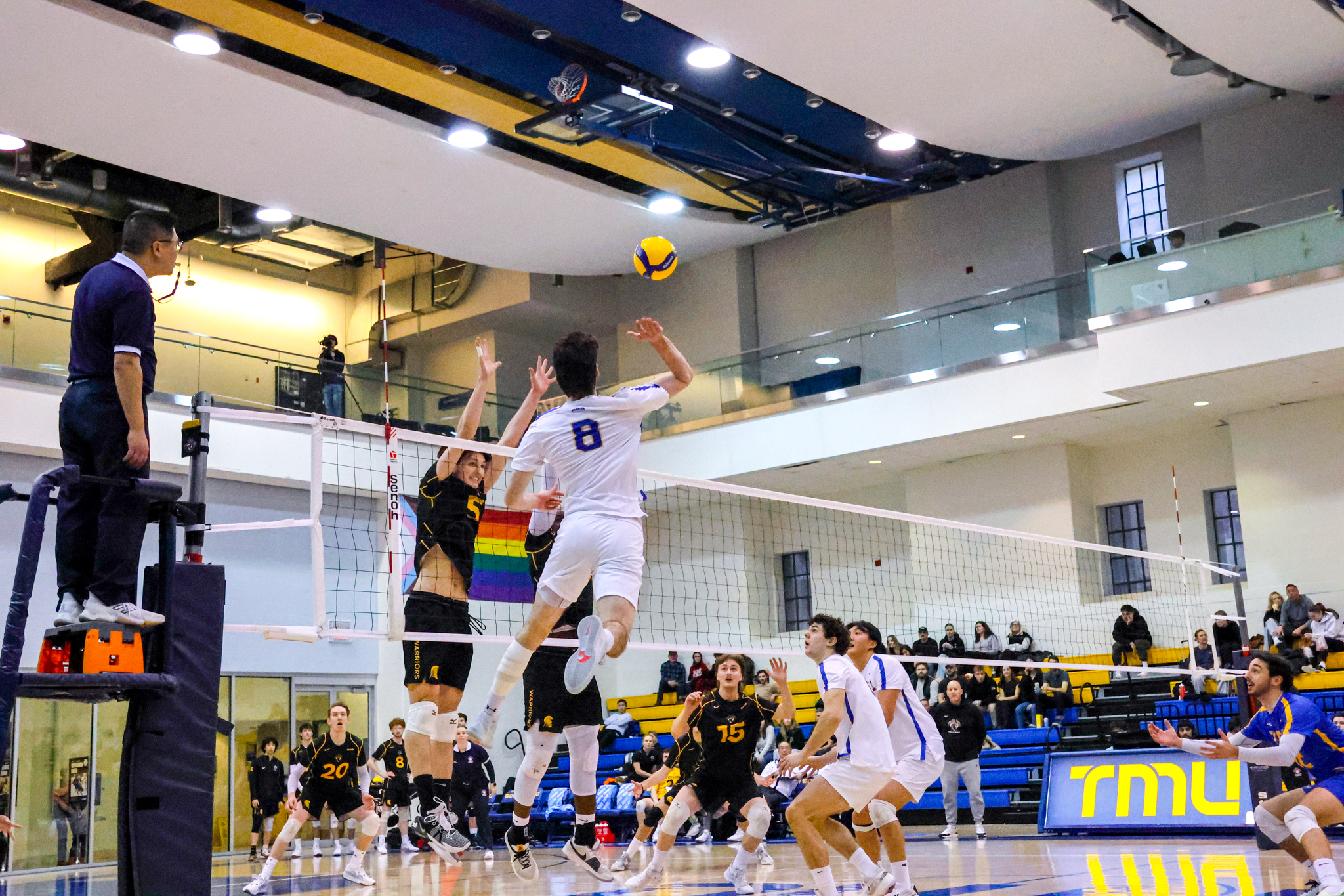 Riley Donovan hitting the ball at the net