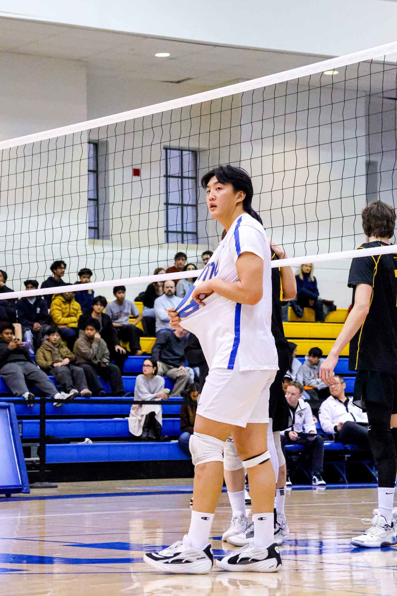 Evan Moua giving directions to his team of where to serve to