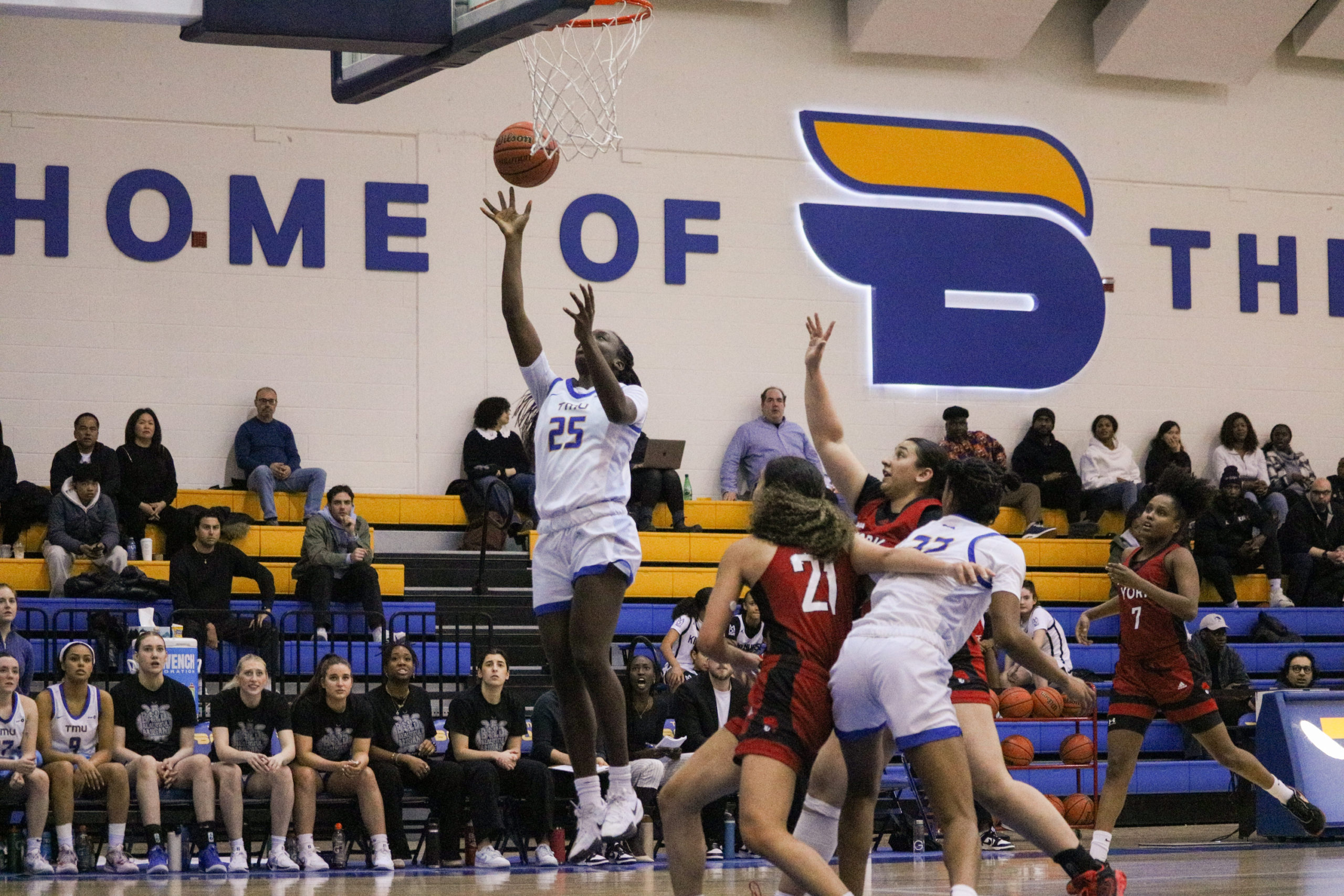 Jessica Keripe jumping for a layup