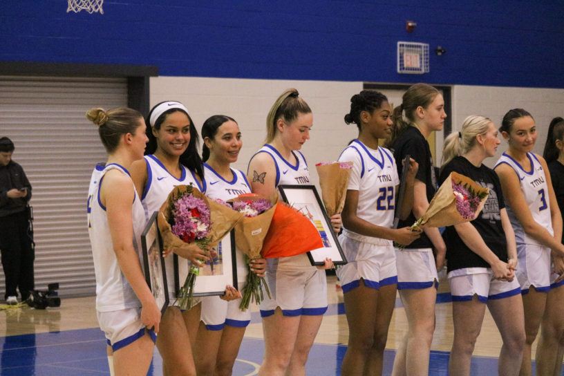 The TMU Bold players celebrating their career as a bold player in senior night