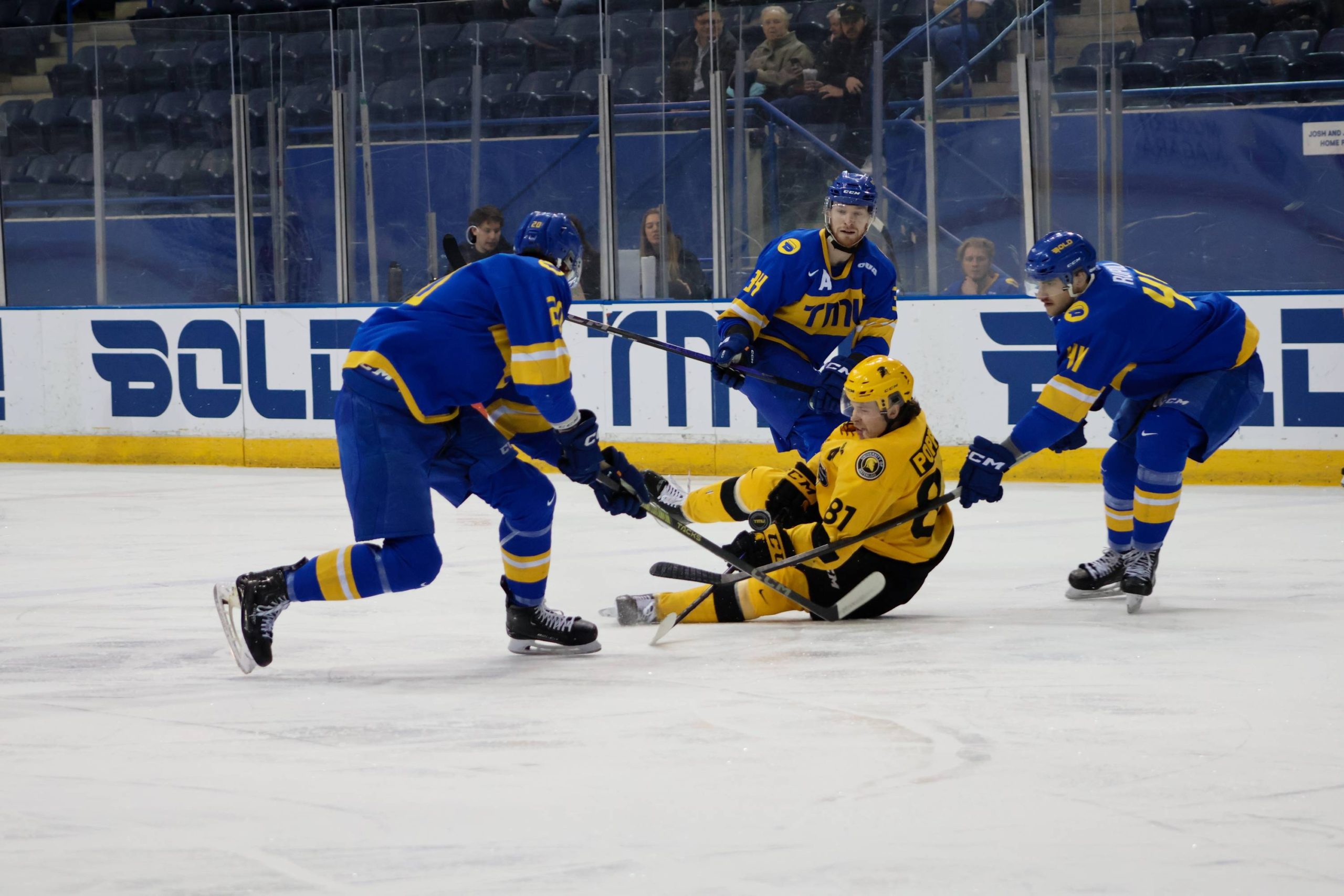 A Warriors player sliding in the floor during a foul