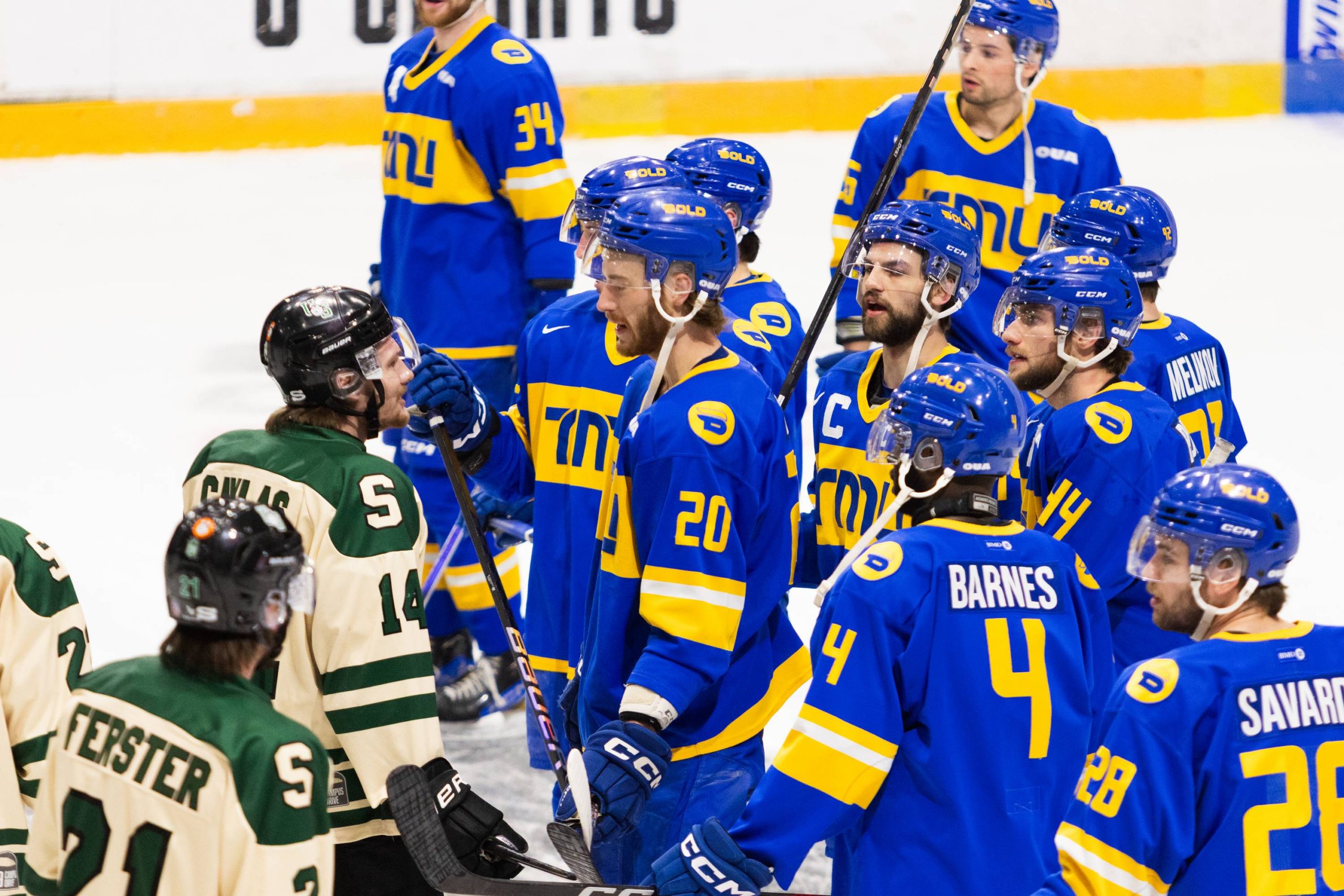 Bold players fighting a Huskie player