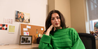 Image of Negin Khodayari in her office her resting head on her fist and looking at the camera