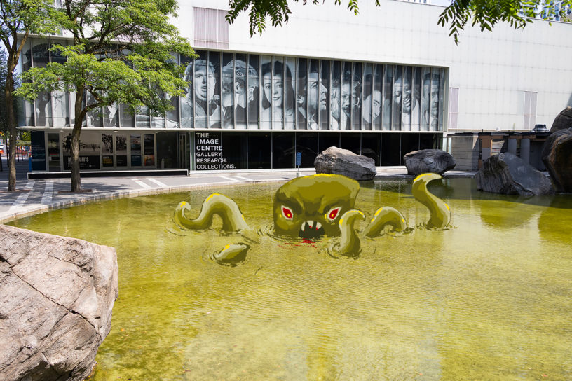 An illustration of a swamp monster emerging from a green coloured Lake Devo.