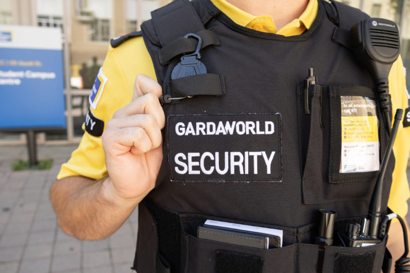 A TMU campus security guards vest with the GARDAWORLD logo on it.