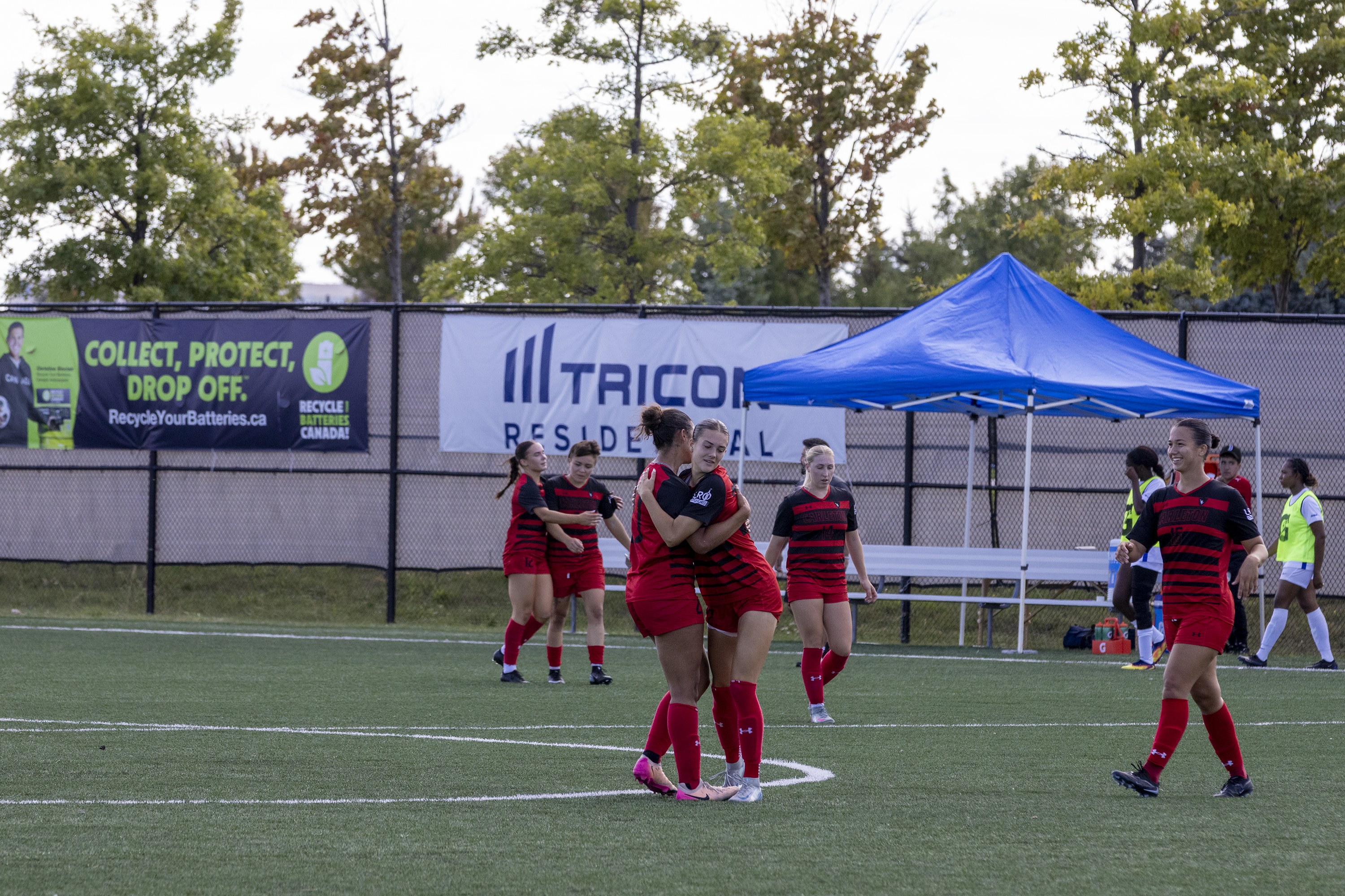 The Carleton Ravens women's soccer team celebrate their win