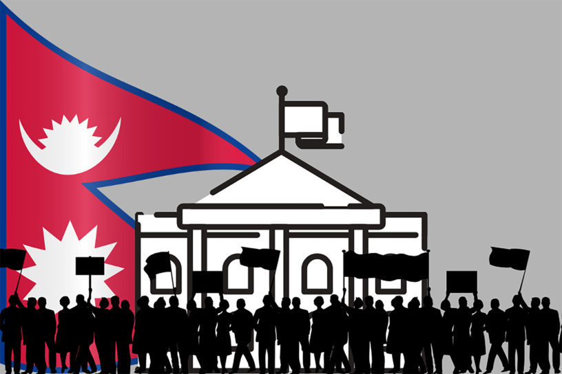 Composition of people protesting at a building with the Nepal flag on the far left.