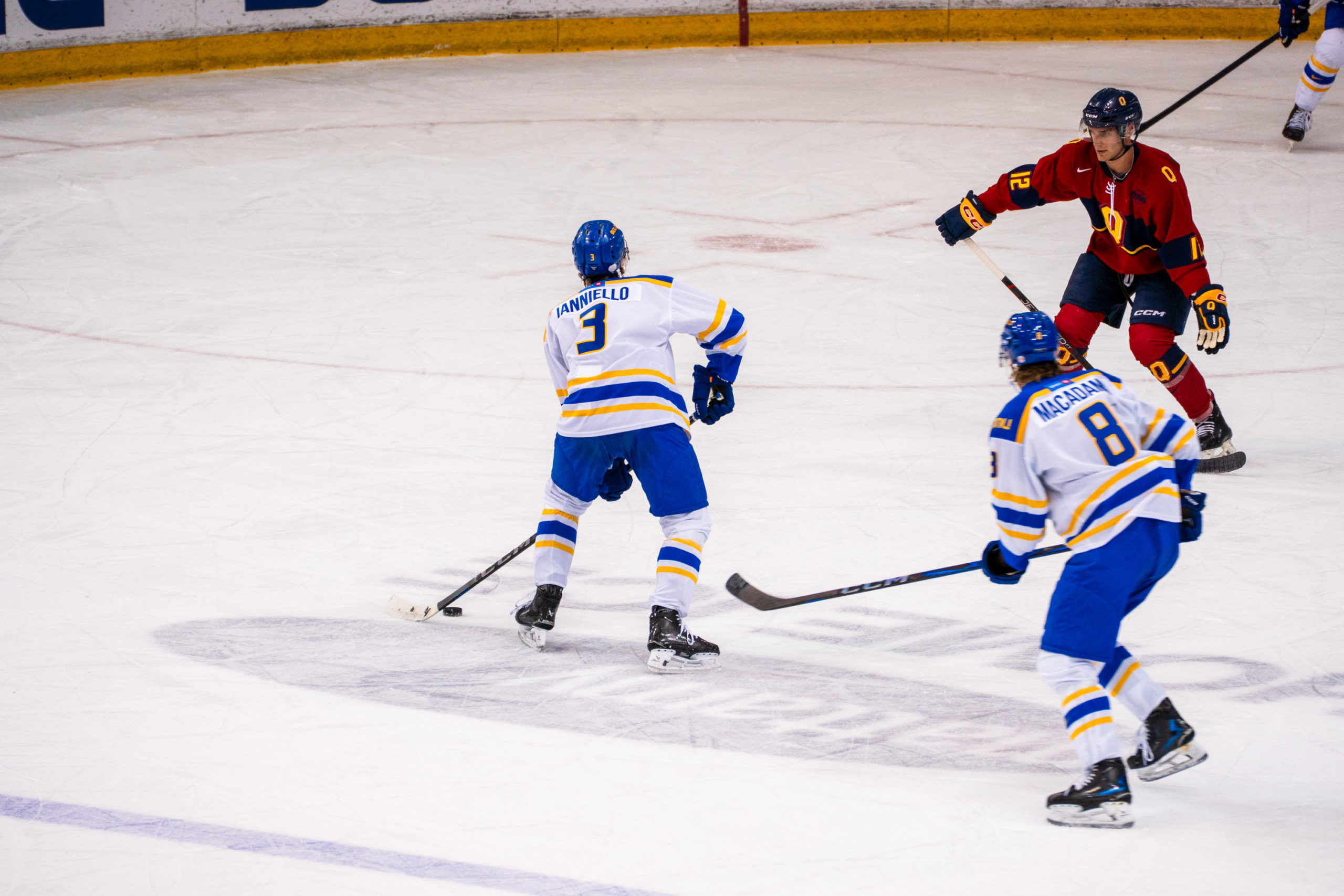 A TMU player handles the puck