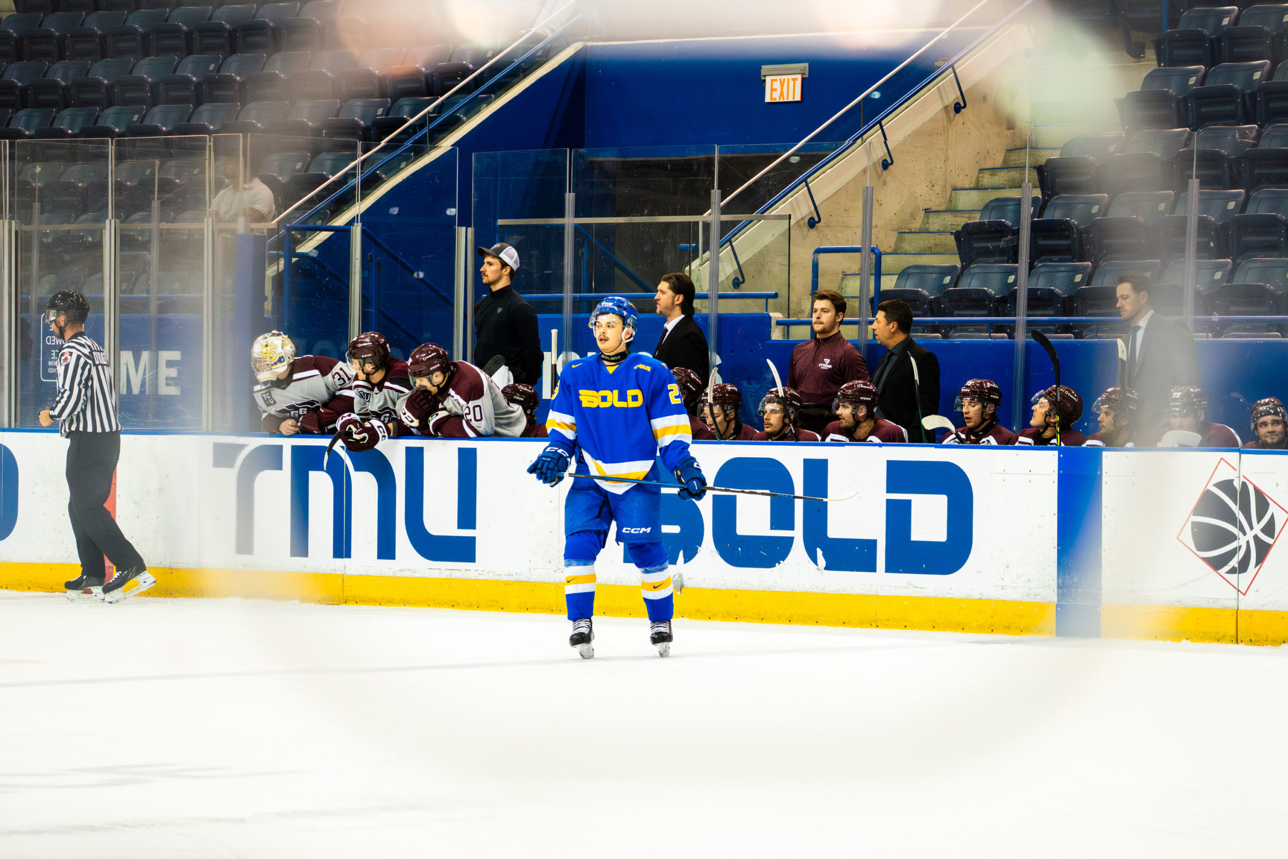 Spencer Shugrue stands in front of the Ottawa bench