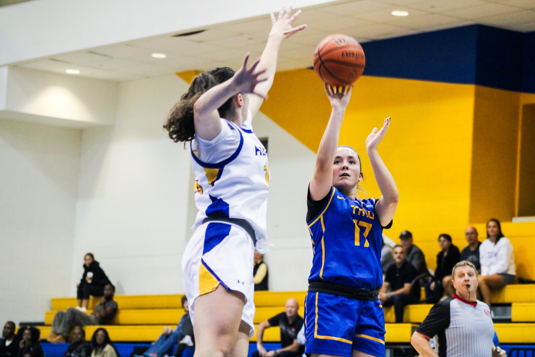 A TMU players makes a shot