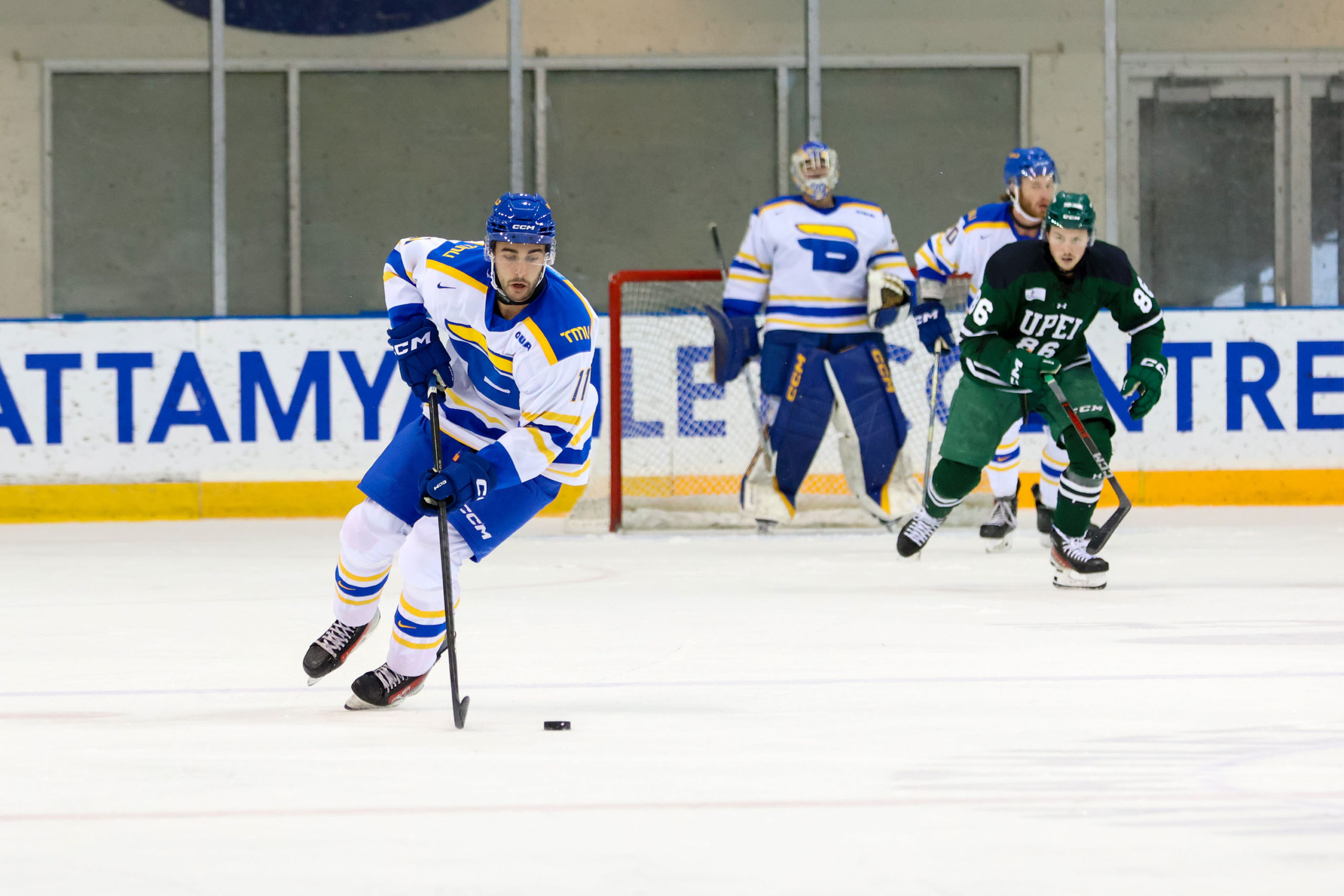 A TMU player gains possession of the puck