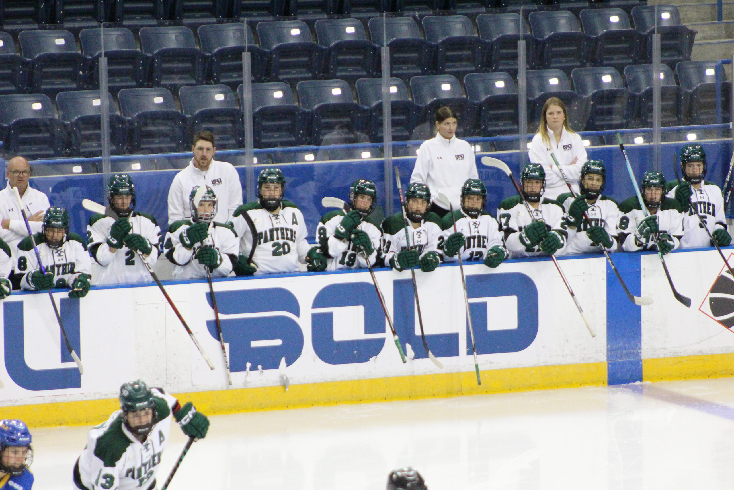UPEI players cheer on their teammates from the bench